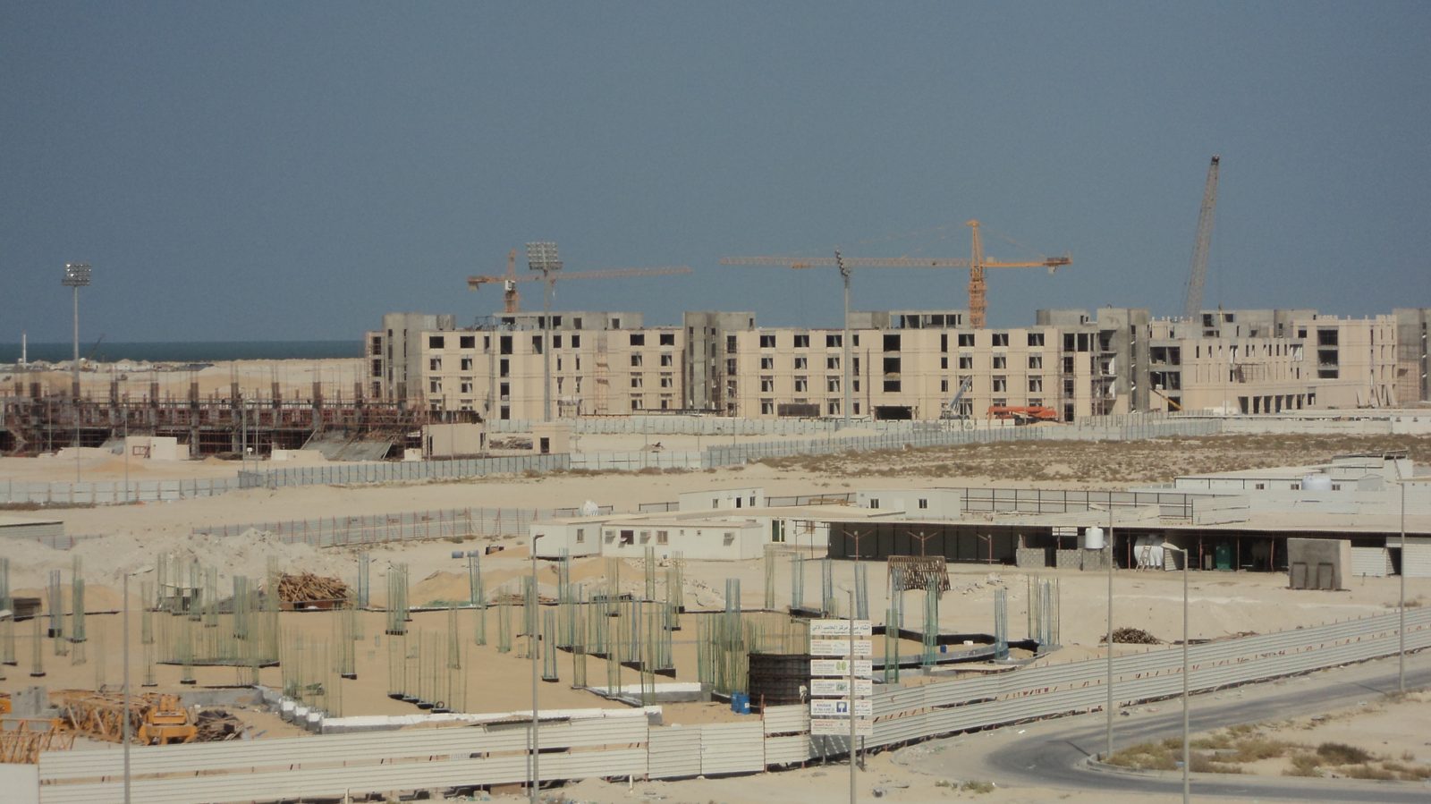 Multiple tower cranes over a large housing development under construction in Saudi Arabia